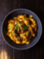 A bowl of pasta with ragu